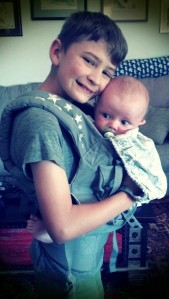 I do not love the effects my wife puts on her phone pictures, but I do love that this kid always wants to wear the baby!